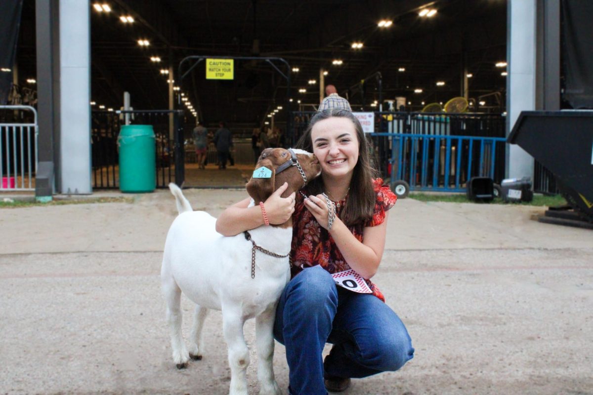 Samantha Skinner poses with her goat, Eli, before the FBCF Auction.