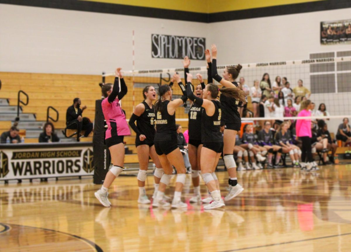 Varsity Volleyball celebrates point scored.