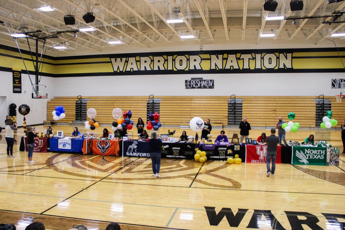Athletes sign their National Letter of Intent (NLI), signifying their official commitment to continue their athletic endeavors in college. 