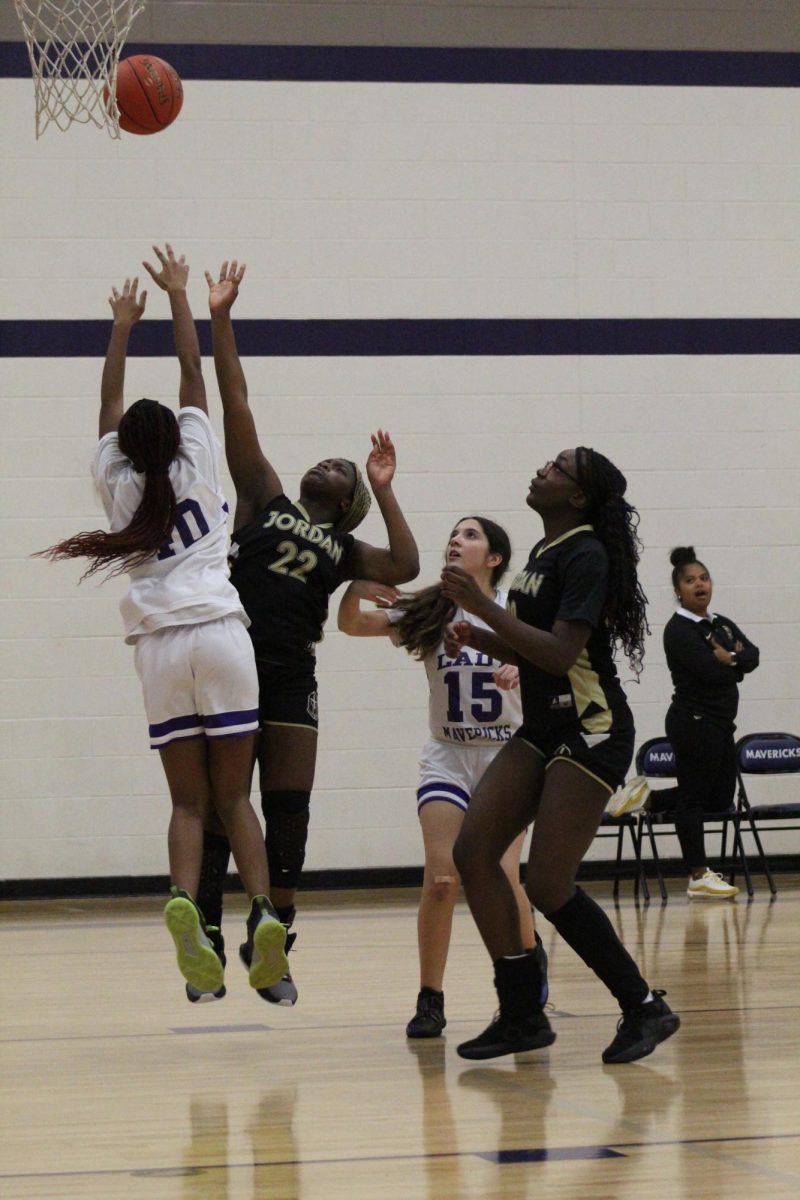 Dominique Akoto-Ampaw shoots the ball in an attempt to gain two points for her team. Every Jordan girls basketball team defeated their opponent: Morton Ranch. 