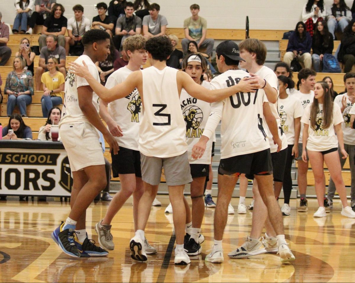 Seniors Mitchell Bridgeforth ‘24, Connor Bowman ‘24, Noah McEntee ‘24, Elijah Betancourt ‘24, Deacon Stanfield ‘24, and Jace Annoot ‘24 gather on the court. Teammates motivated each other in between rounds to keep spirits high.