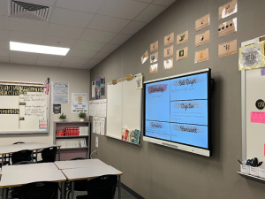 A Jordan High School teacher displays posters on their classroom wall.